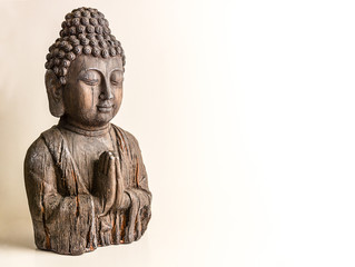 Lateral buddha bust on a white background