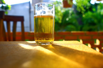 A glass of beer on a table