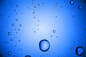 fresh drops background blue glass / wet rainy background, water drops transparent glass blue