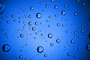 fresh drops background blue glass / wet rainy background, water drops transparent glass blue