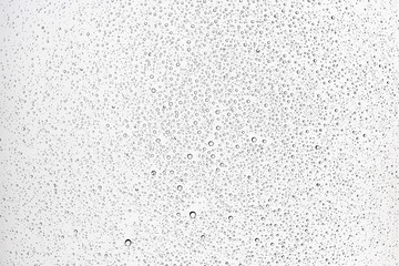 white isolated background water drops on the glass / wet window glass with splashes and drops of water and lime, texture autumn background