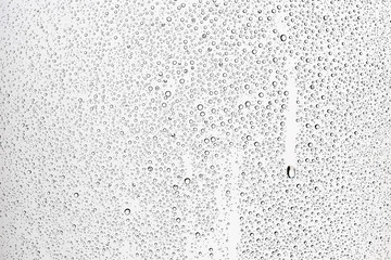 gray wet background / raindrops to overlay on the window, weather, background drops of water rain on the glass transparent