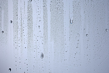 Naklejka na ściany i meble gray wet background / raindrops to overlay on the window, weather, background drops of water rain on the glass transparent