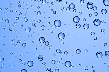 fresh drops background blue glass / wet rainy background, water drops transparent glass blue