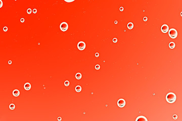 red wet background / raindrops to overlay on a window, weather, background drops of water rain on a glass transparent