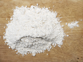 Fototapeta na wymiar white flour on wood