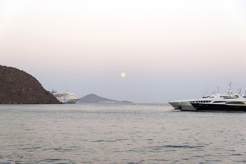 ship in sea at sunset