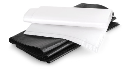roll of disposable trash bags isolated over white background