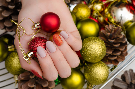 Beautiful female hand with christmas nail design