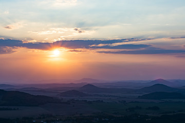 Obraz premium Landscape with the sunset. Orange enlightened cloud clouds and dark landscape.