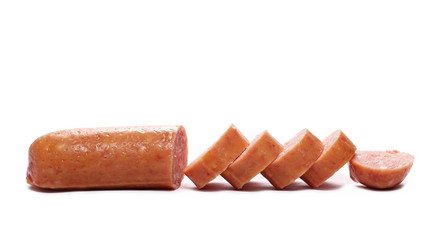 Sausages with slices isolated on white background