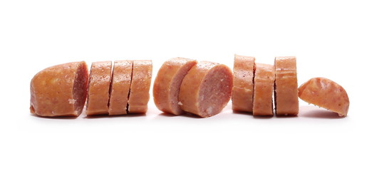 Sausages with slices isolated on white background