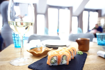 glass of white wine in the restaurant / white wine in the interior of the restaurant a table with glasses of wine, a romantic summer