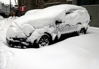 Car is covered with snow - car under snow