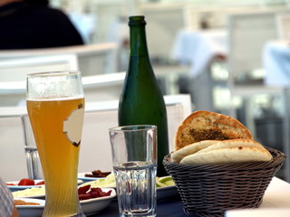 Empty glass with a glass of beer and a breadbasket