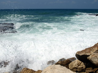 Wave splashing against stones