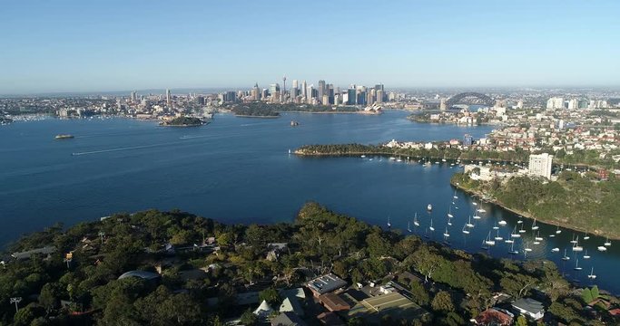 Lower North Shore suburbs around Mosman over Taronga Zoo on Sydney Harbour shores aerial flying towards city CBD Landmarks.
