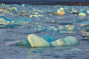 Frozen Jokulsarlon glacier lake lagoon at sunset. Vatnajokull National Park. Iceland.