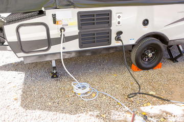 filling the water tank of a campervan