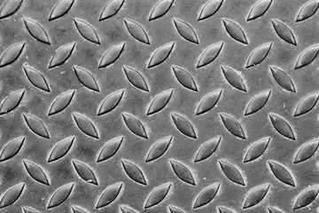 Old rusty diamond metal plate texture pattern used as abstract background