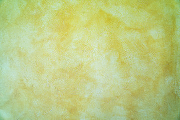 Yellow paint cement wall , vintage wall Textured background .