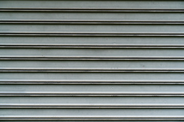 close up of metallic roll up door surface