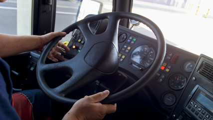 Naklejka premium Closeup photo of driver driving big truck