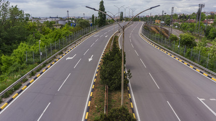 road infrastructure and rail infrastructure on the background of the urban landscape. car and truck...