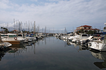 Fototapeta na wymiar Boats in the harbor and reflection