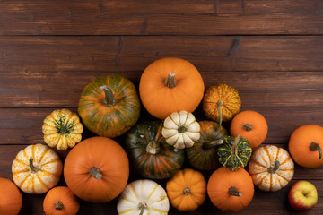Pumpkins on wooden background