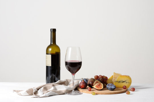 wine, cheese and fruits