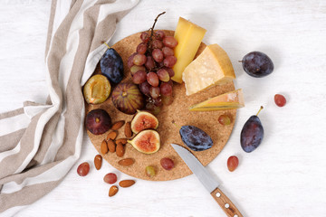 plate with cheese and fruits
