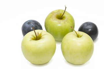 juicy blue plums and green apples