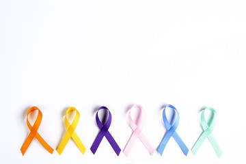 Set of multiple awareness ribbons, six different colors that symbolize different charitable events,...