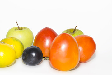 plum, persimmon, apples, tangerines on isolated background