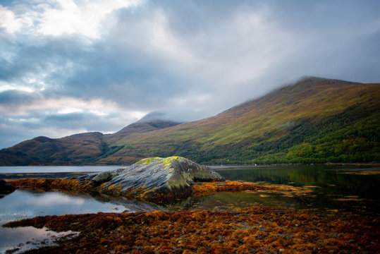View of Dramatic Cloud Capped Hills Across Loch Ailort at Sunrise, HIghlands, Scotland, UK