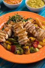 Grilled chicken meat on skewer