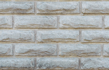 Naklejka premium Gray brick wall. Concrete fence. Textural background. Close-up.