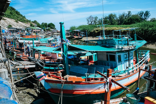 Fototapeta Colorful fishing boats at harbor in Hua Hin Prachuap Khiri Khan Province, Thailand