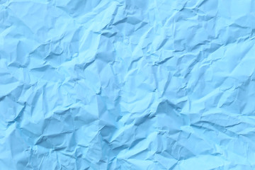 blue arctic color of crumpled or wrinkled paper background.