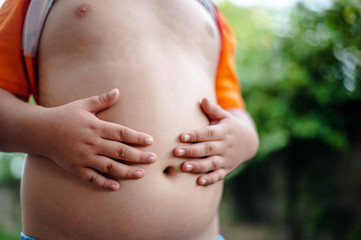 Fototapeta na wymiar Fat boy eat a lot Caused by eating a lot. And not health care Fat Obesity Concept