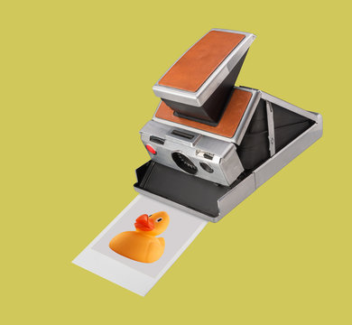 Polaroid Instant Film camera with print of rubber duck