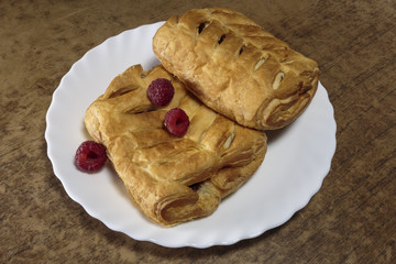 Fresh sweet pastries with raspberry jam. Sweet desert closeup.