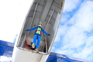 Sport girl is doing first step from an airplane.