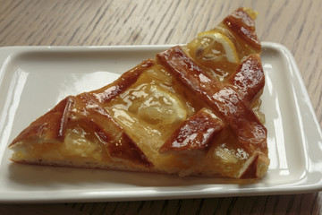 Fresh sweet pastries with lemon jam on a tray. Sweet desert closeup.