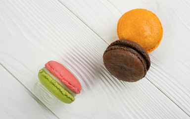 French macarons on white wooden background