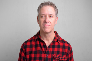 Fototapeta premium Mature hipster man wearing red checkered shirt