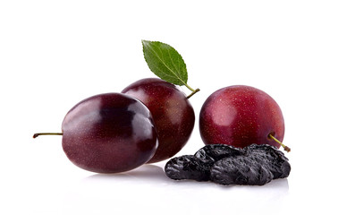 Plums with dried prunes  on white background.