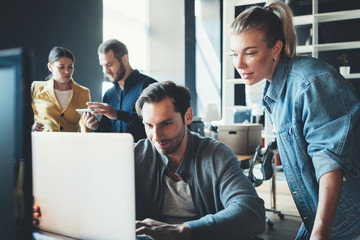 Business concept. Team working together at the project in big open space office