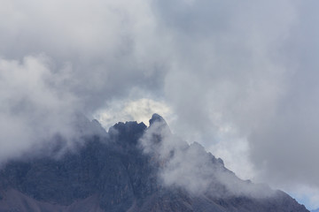 Beautiful summer scenery in the Dolomite Alps, Italy, with dramatic storm clouds